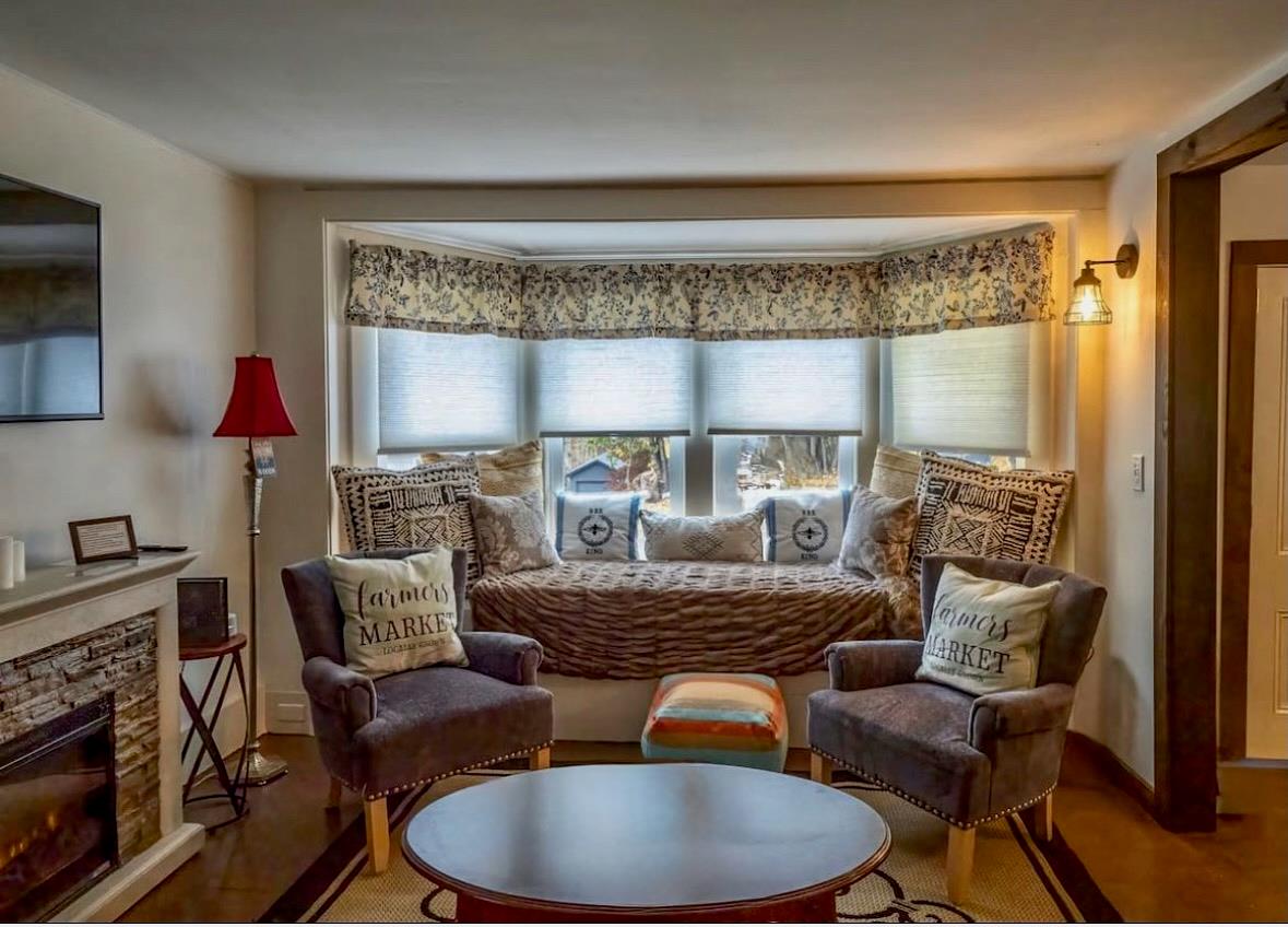 21 Mitchell Avenue Callicoon, NY 12723 - Photo 15 of 33 Sitting room featuring a stone fireplace and wood finished floors