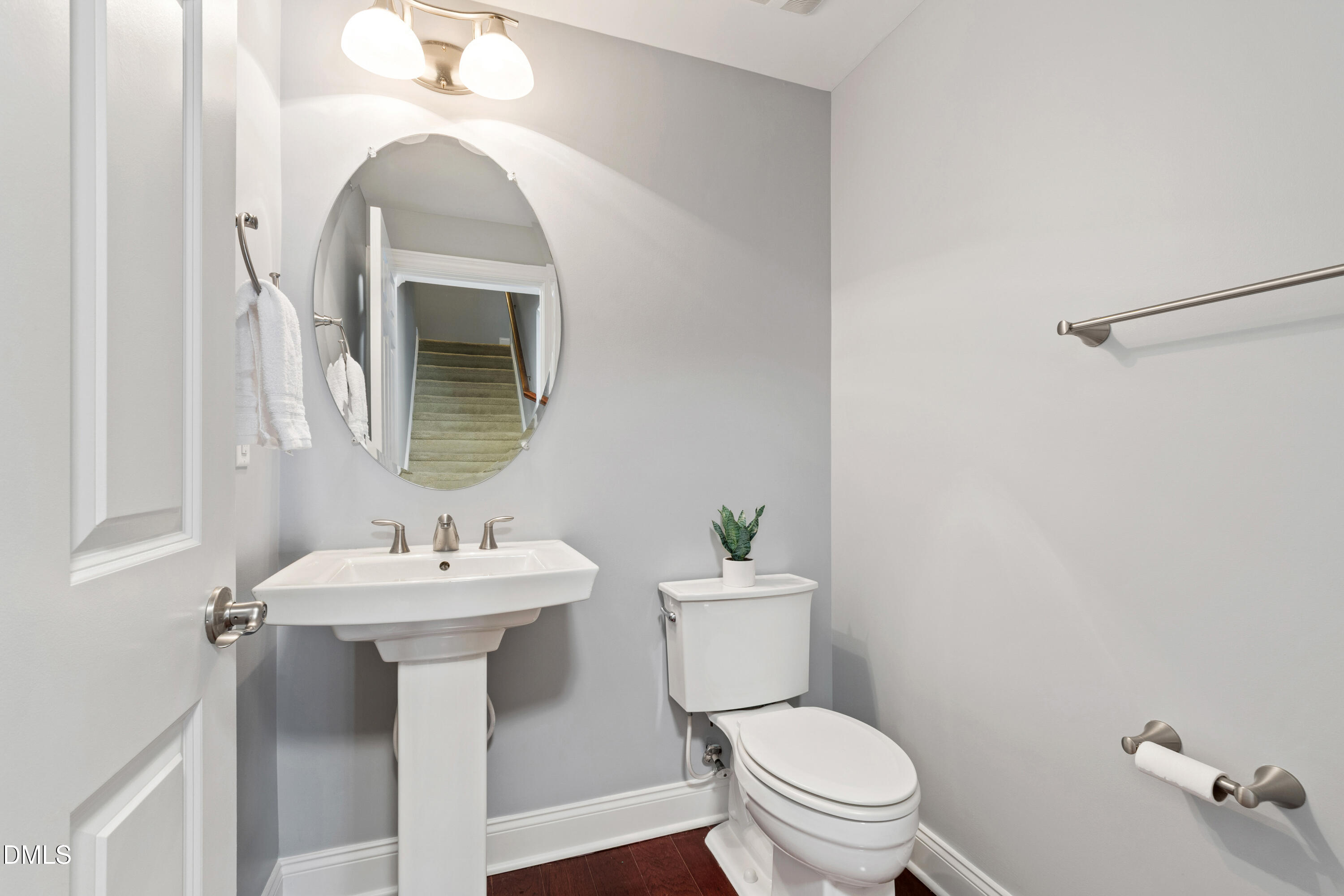 10321 Sablewood Drive, Unit 108 Raleigh, NC 27617 - Photo 15 of 41 a bathroom with a toilet sink and mirror