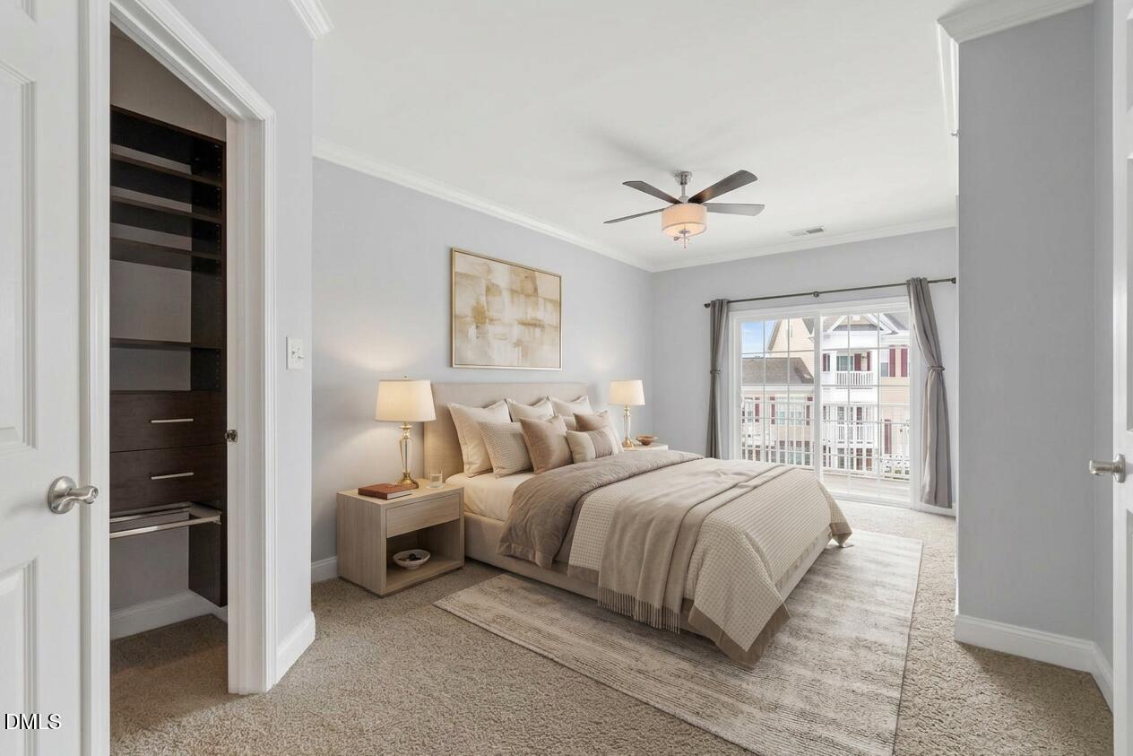 10321 Sablewood Drive, Unit 108 Raleigh, NC 27617 - Photo 20 of 41 a bedroom with bed and a large window