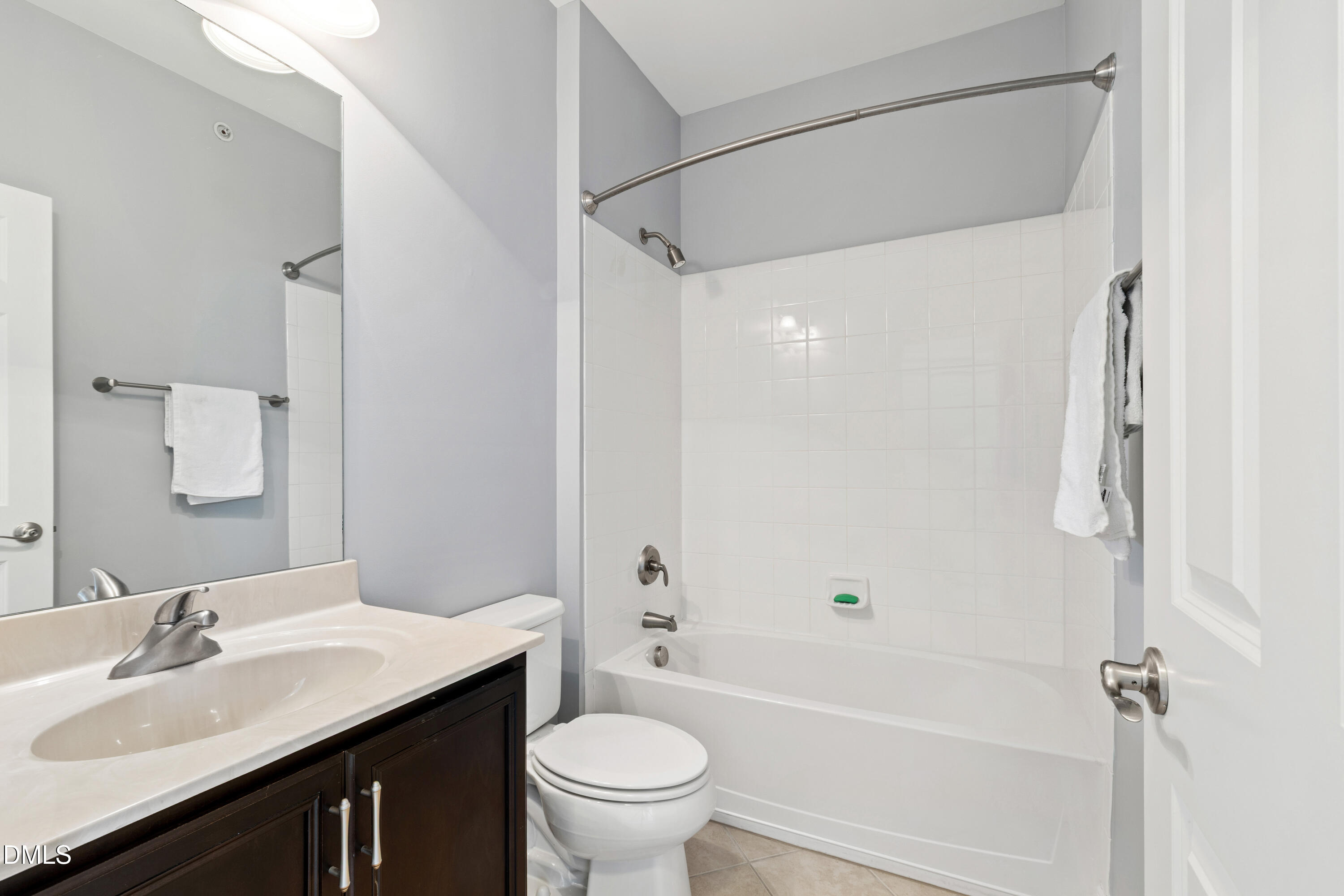 10321 Sablewood Drive, Unit 108 Raleigh, NC 27617 - Photo 28 of 41 a bathroom with a sink and a mirror