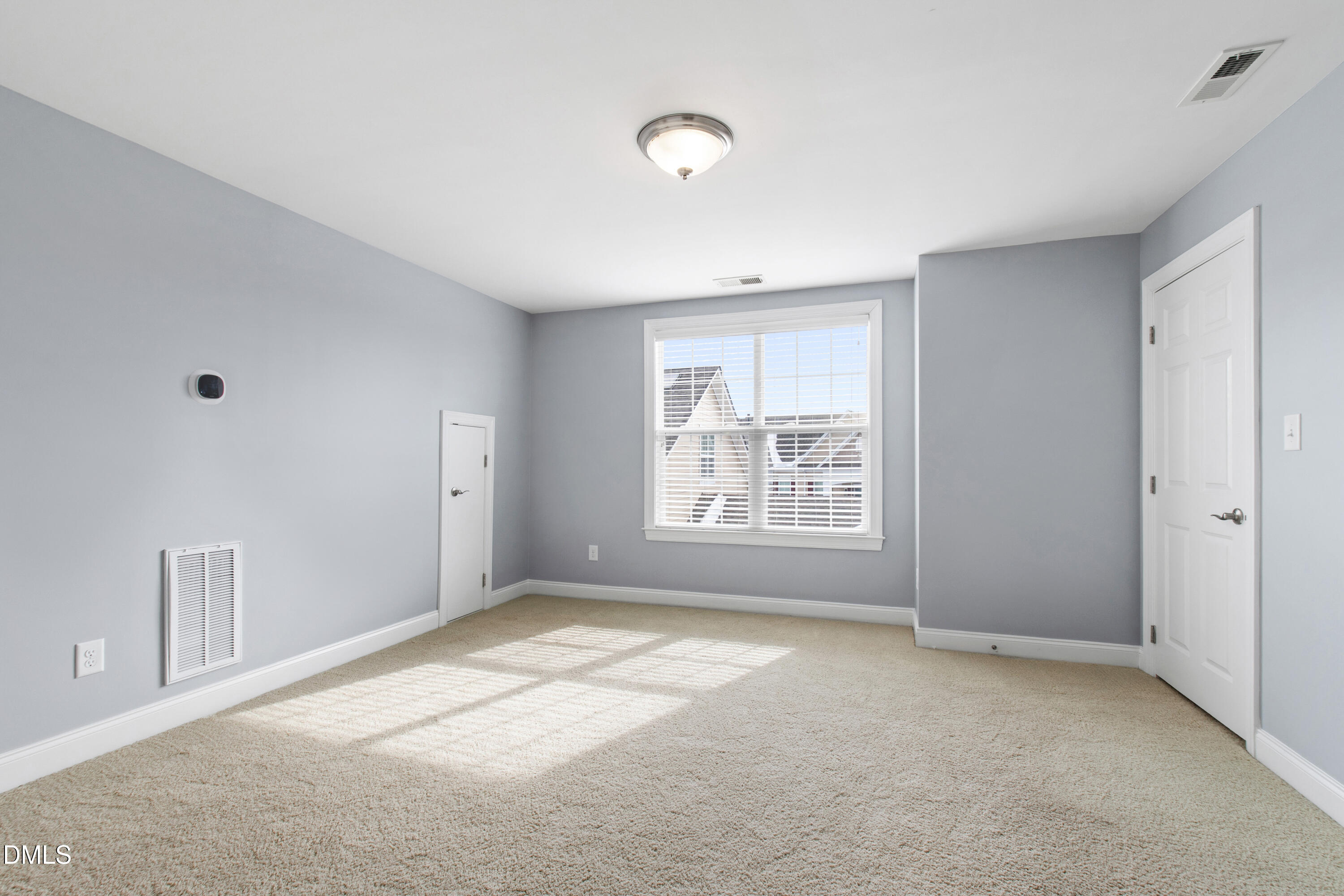 10321 Sablewood Drive, Unit 108 Raleigh, NC 27617 - Photo 31 of 41 a view of an empty room with a window