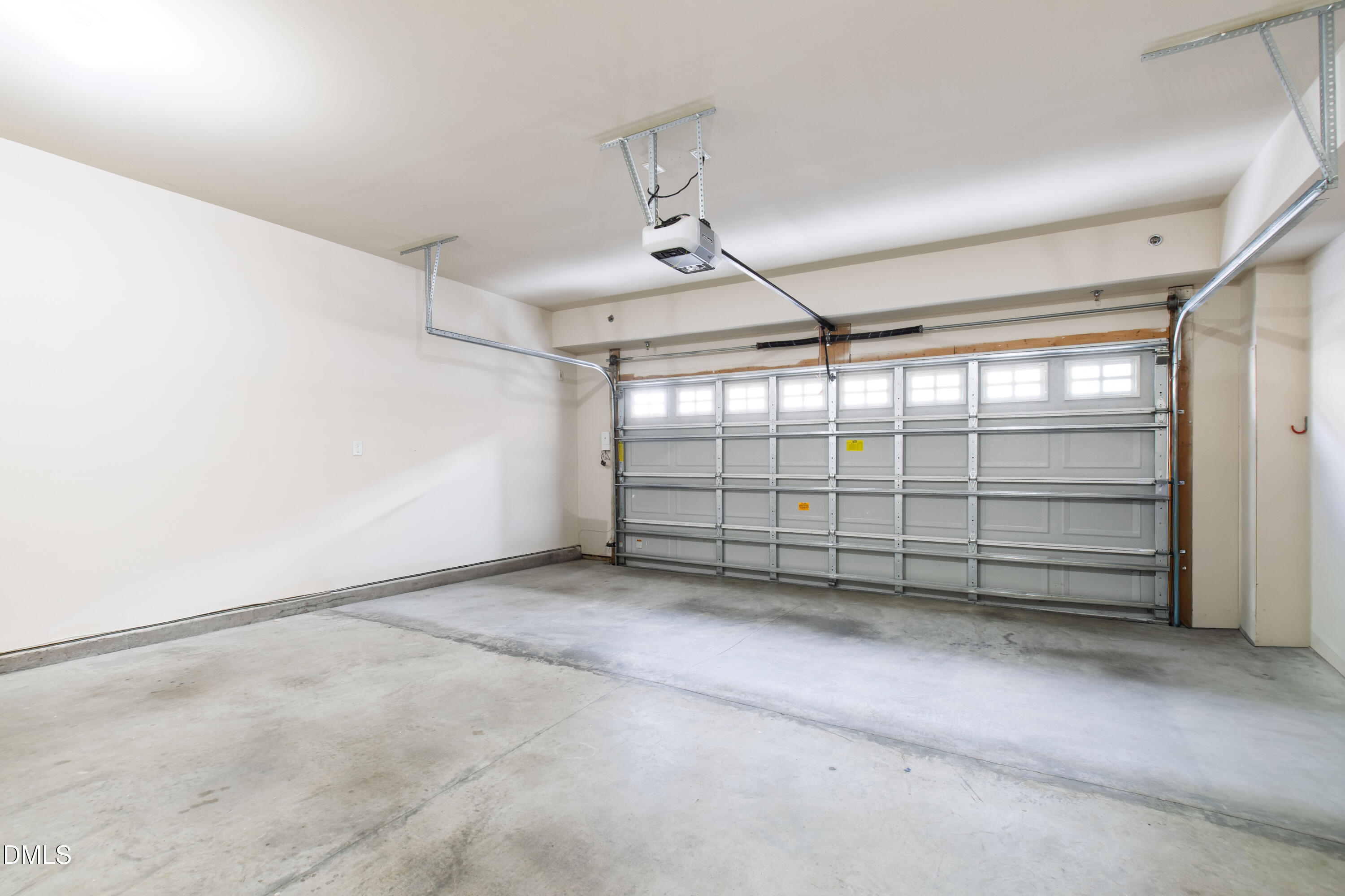 10321 Sablewood Drive, Unit 108 Raleigh, NC 27617 - Photo 35 of 41 an empty room with windows