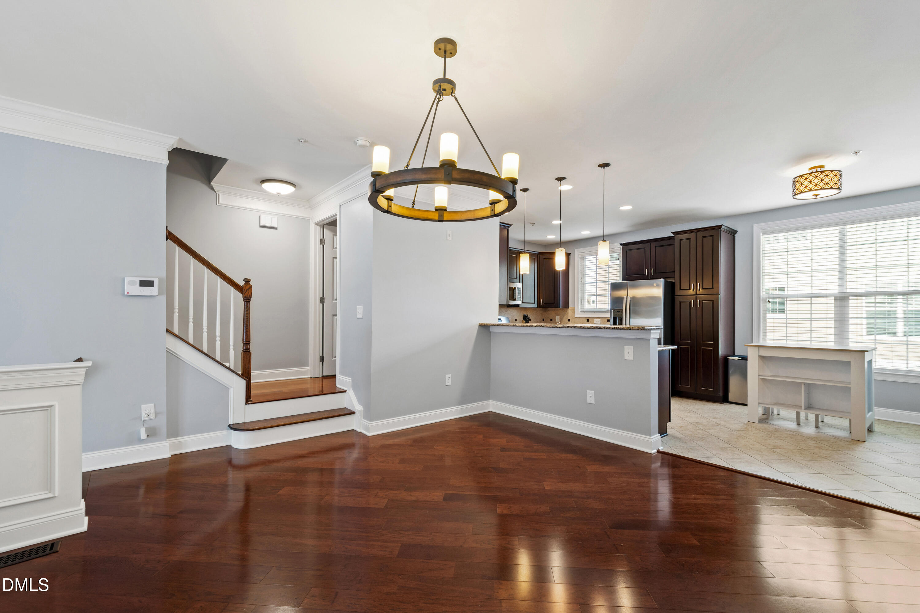 10321 Sablewood Drive, Unit 108 Raleigh, NC 27617 - Photo 8 of 41 a view of a kitchen with wooden floor and a window