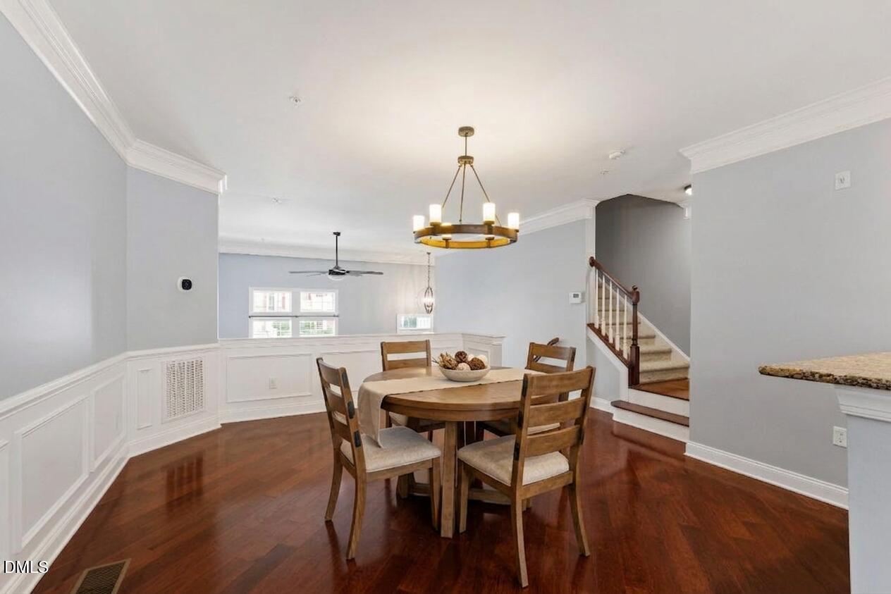 10321 Sablewood Drive, Unit 108 Raleigh, NC 27617 - Photo 10 of 41 a dining room with furniture and window