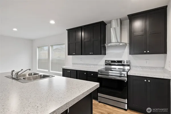 a kitchen with a stove and a sink