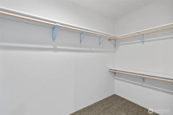 a view of an empty walk in closet