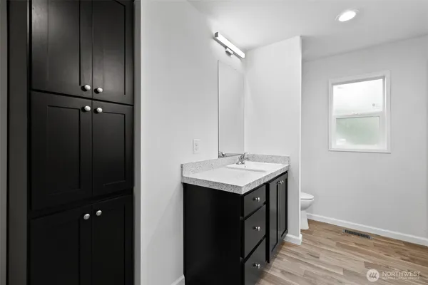 a kitchen with a sink and cabinets
