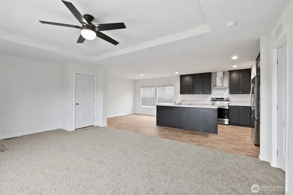 a view of kitchen with sink microwave and refrigerator