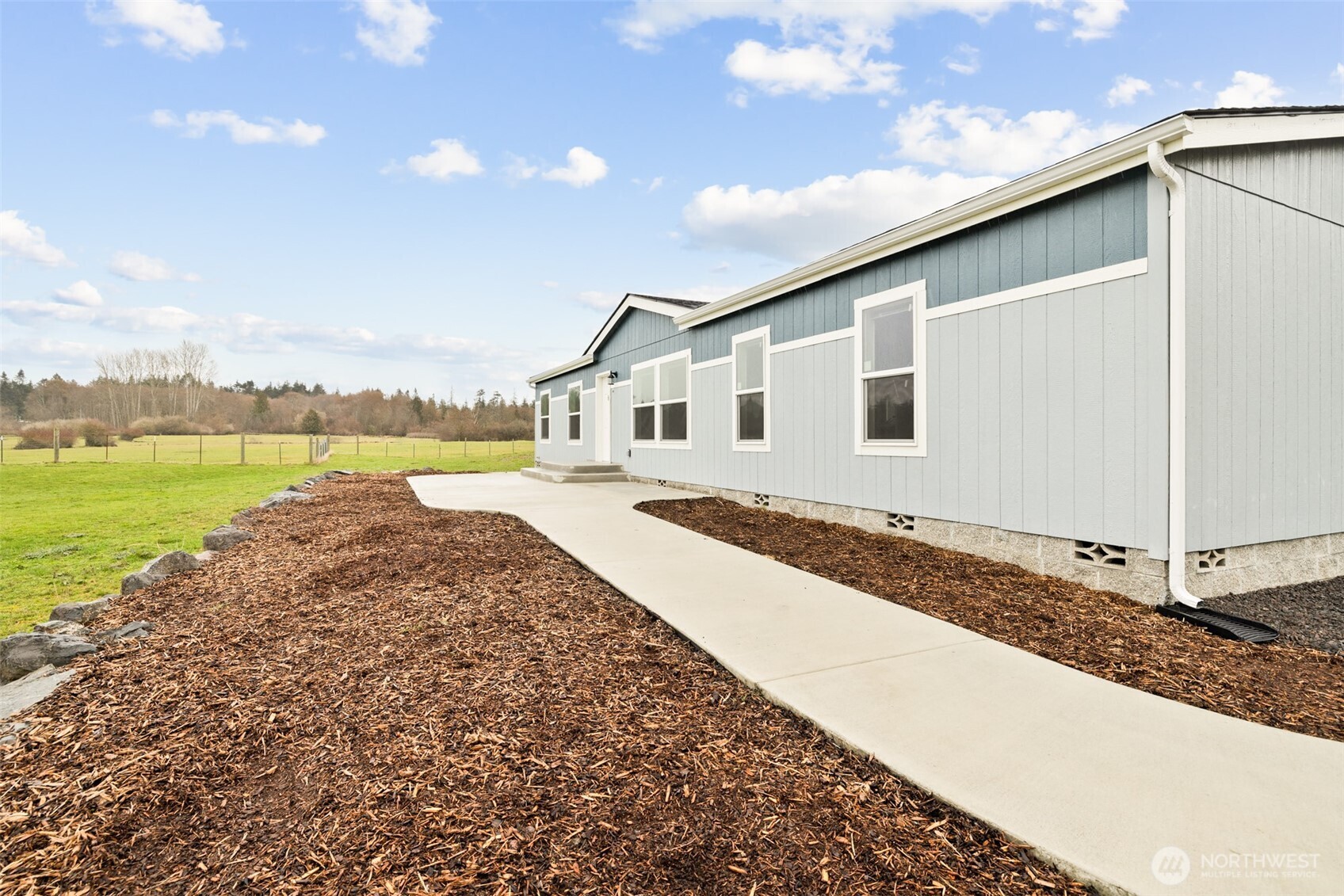 591 North Lees Creek Road Port Angeles, WA 98362 - Photo 31 of 39 a view of a house with a yard and ocean view