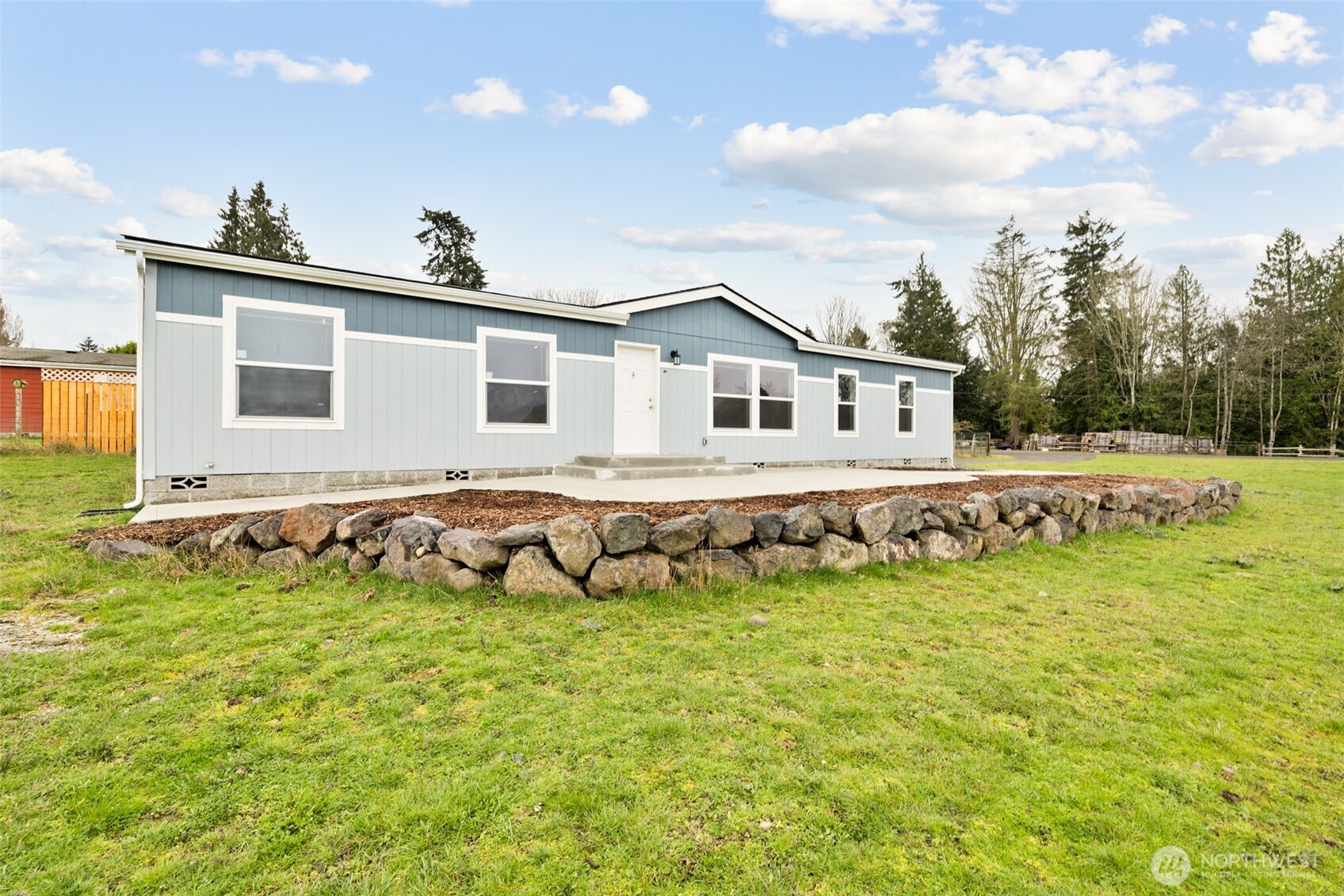 591 North Lees Creek Road Port Angeles, WA 98362 - Photo 35 of 39 a view of a house with a yard and sitting area