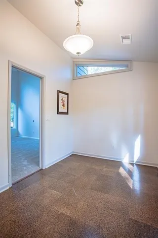 a view of an empty room and window