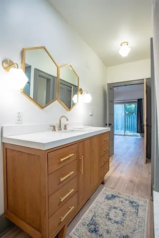 a bathroom with a sink and a mirror