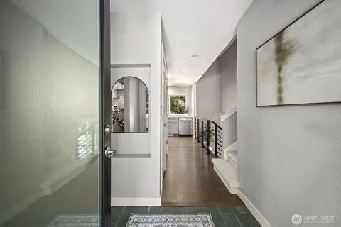a living room with furniture and kitchen view