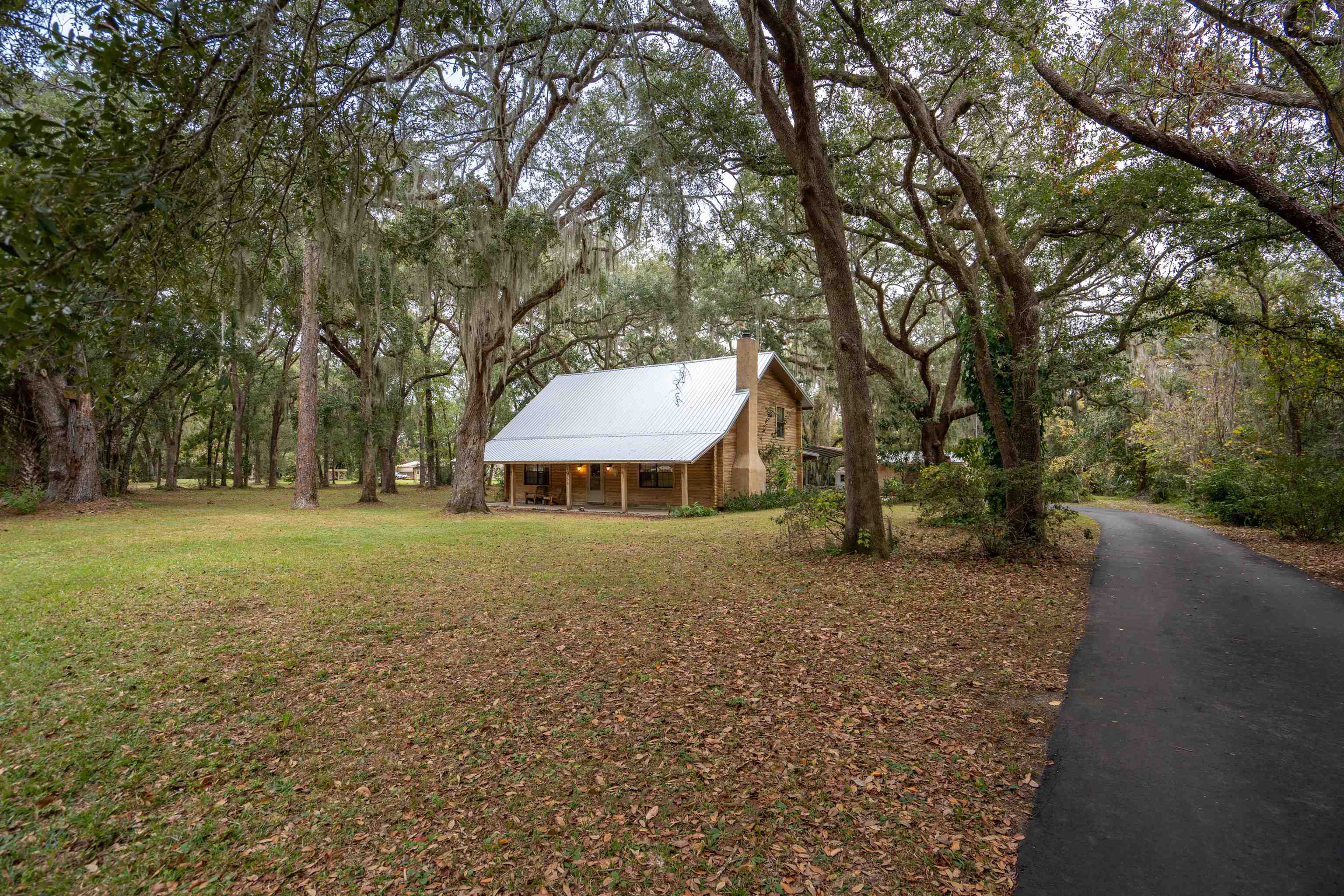 5850 Capo Island Road St. Augustine, FL 32095 - Photo 1 of 39 a view of a house with a yard