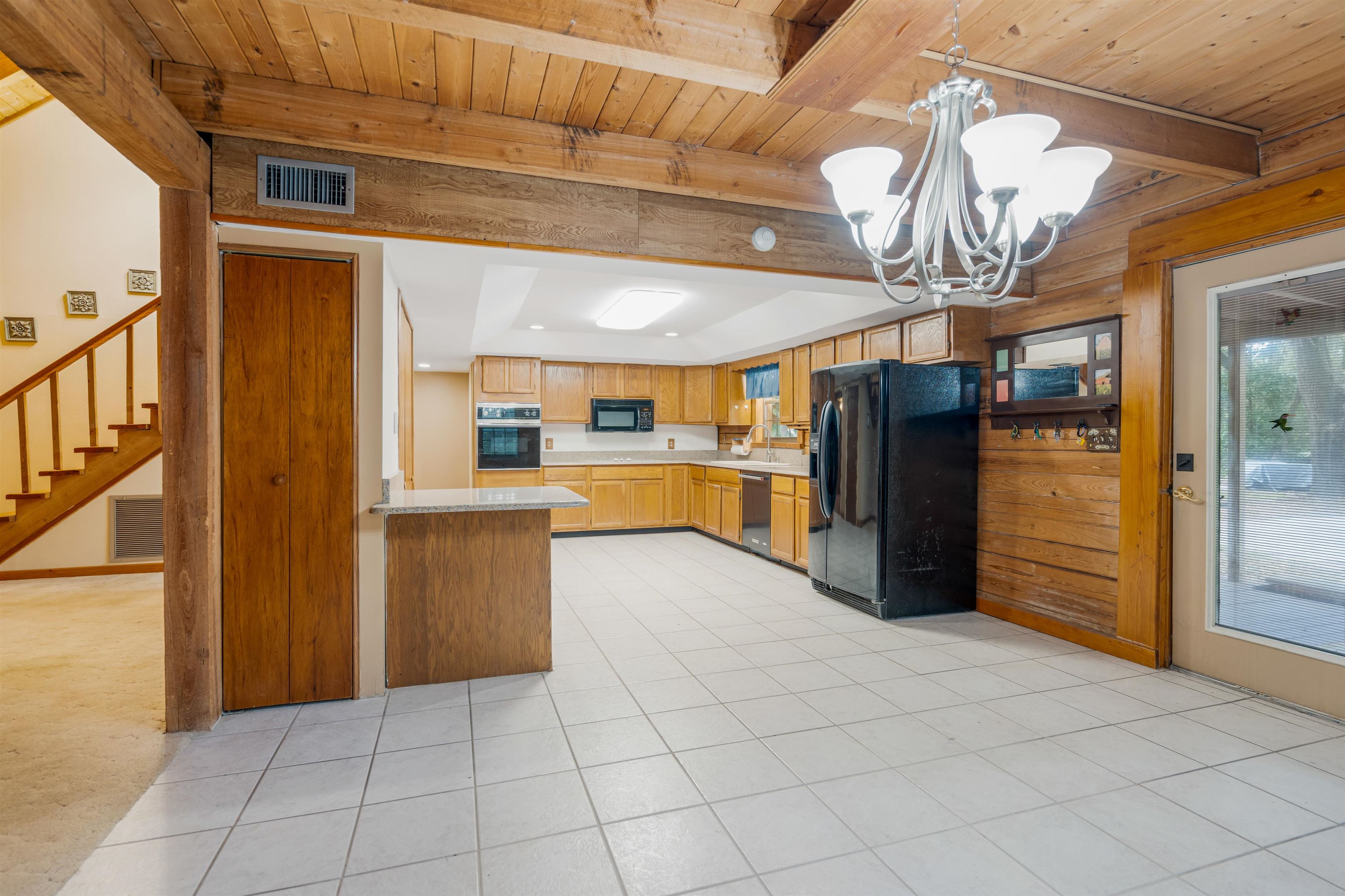 5850 Capo Island Road St. Augustine, FL 32095 - Photo 15 of 39 a view of a kitchen with a sink and a refrigerator