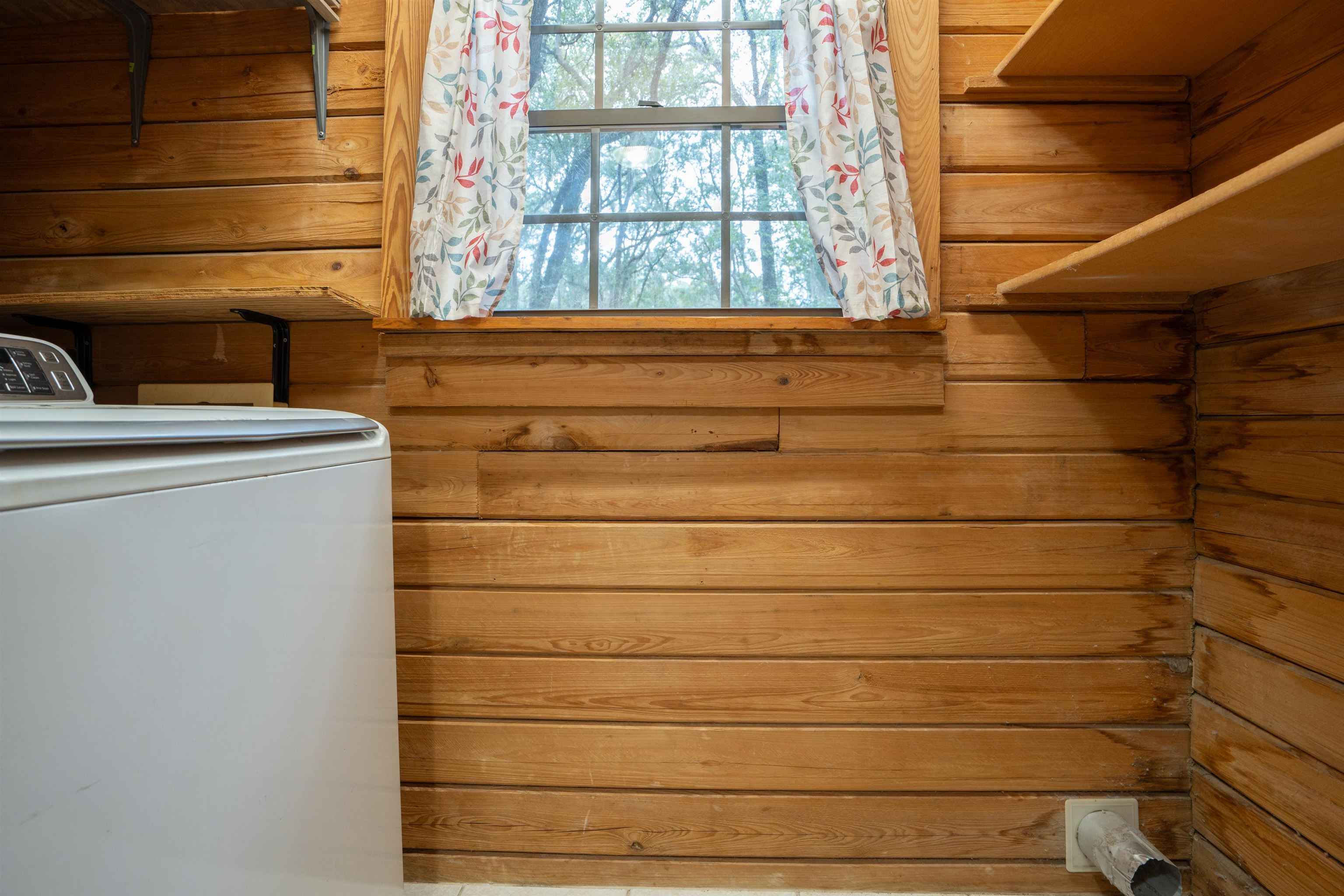 5850 Capo Island Road St. Augustine, FL 32095 - Photo 20 of 39 a bathroom with a shower and a window