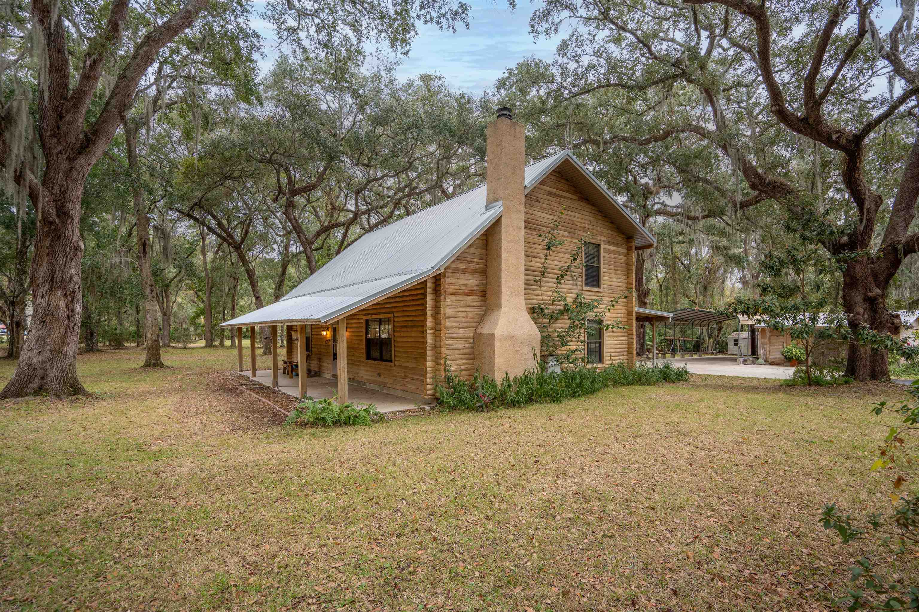 5850 Capo Island Road St. Augustine, FL 32095 - Photo 2 of 39 a view of a house with a yard
