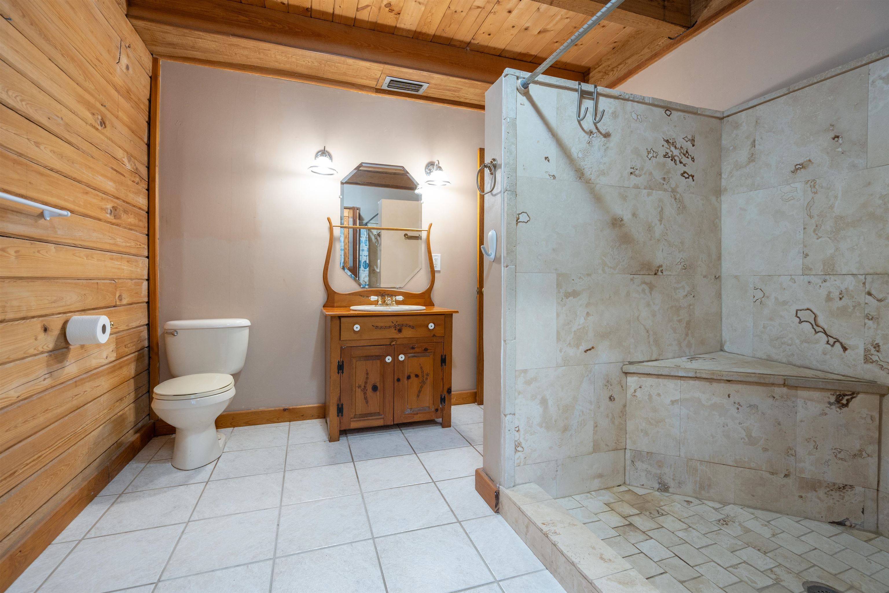 5850 Capo Island Road St. Augustine, FL 32095 - Photo 21 of 39 a bathroom with a toilet a sink and shower