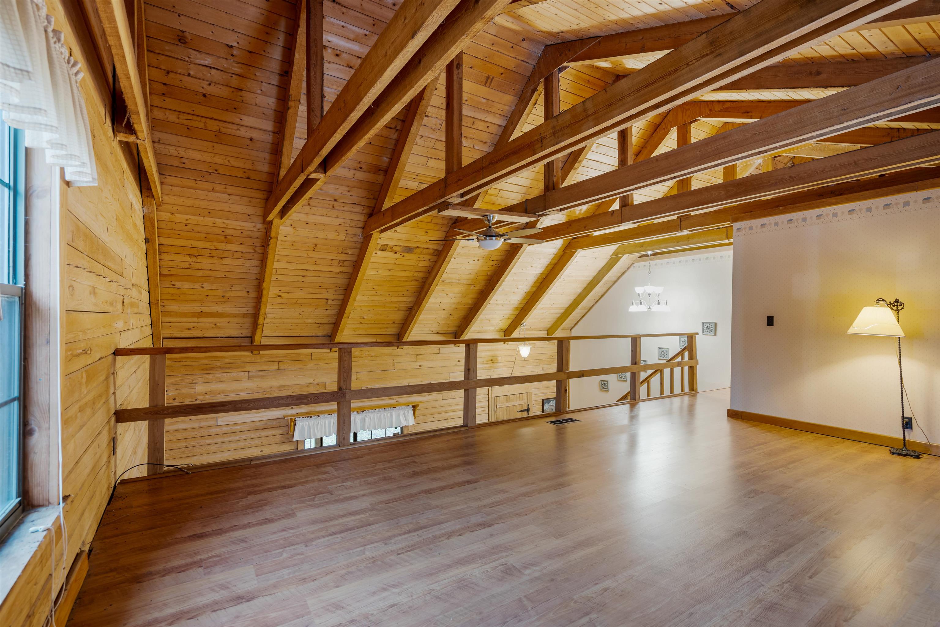 5850 Capo Island Road St. Augustine, FL 32095 - Photo 25 of 39 a view of an empty room with wooden floor