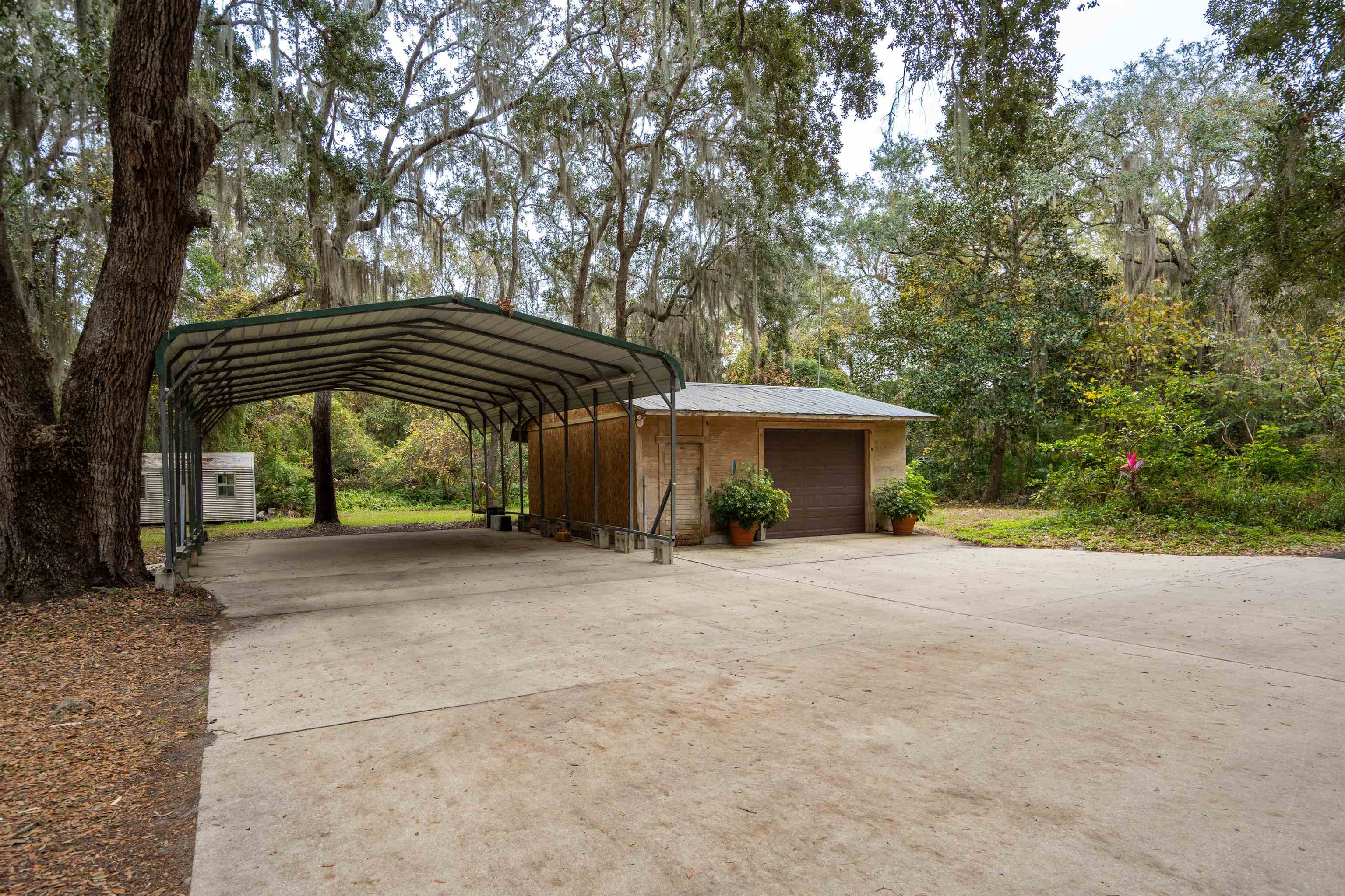 5850 Capo Island Road St. Augustine, FL 32095 - Photo 35 of 39 a view of a house with a yard and tree