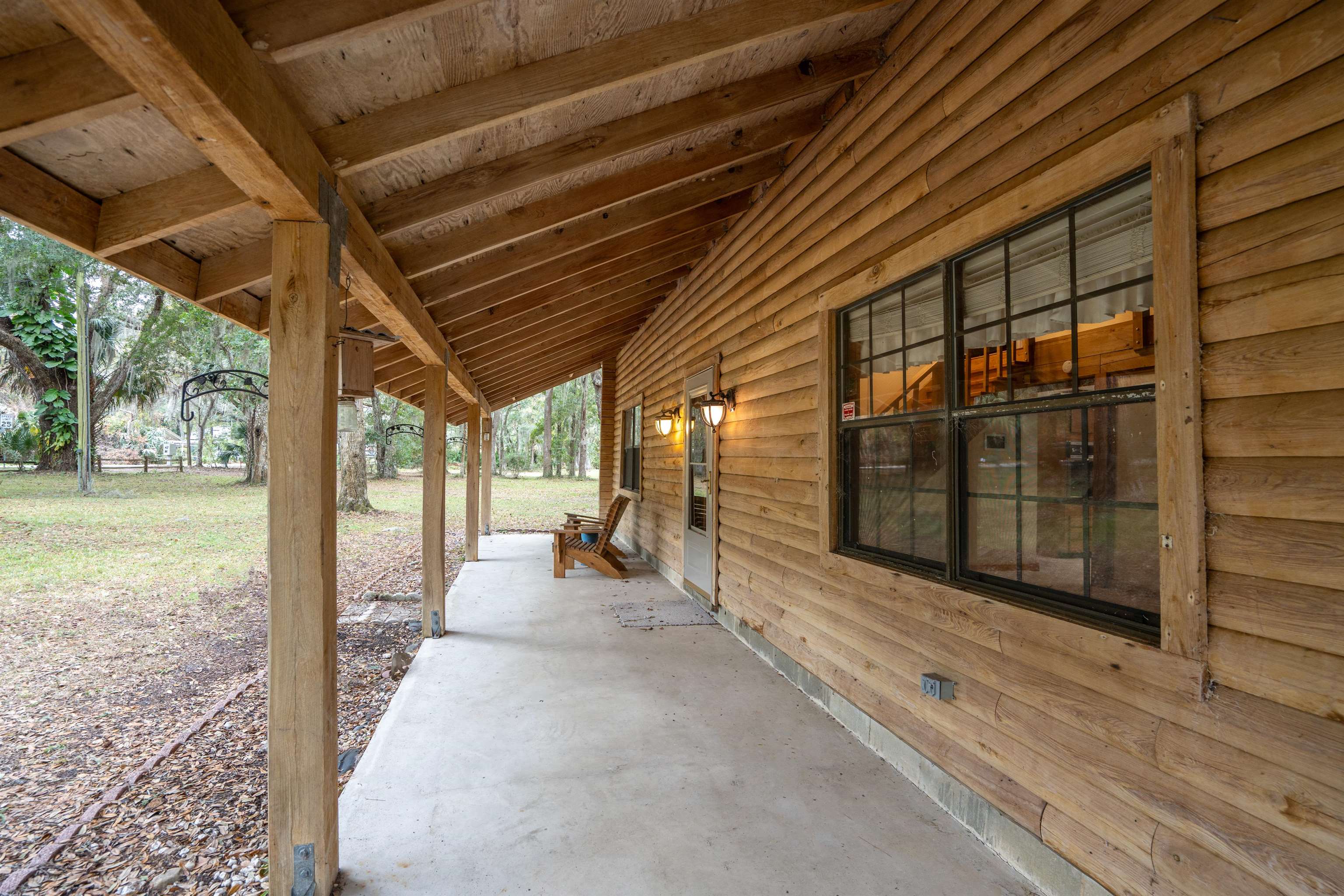 5850 Capo Island Road St. Augustine, FL 32095 - Photo 5 of 39 a view of a porch with wooden floor