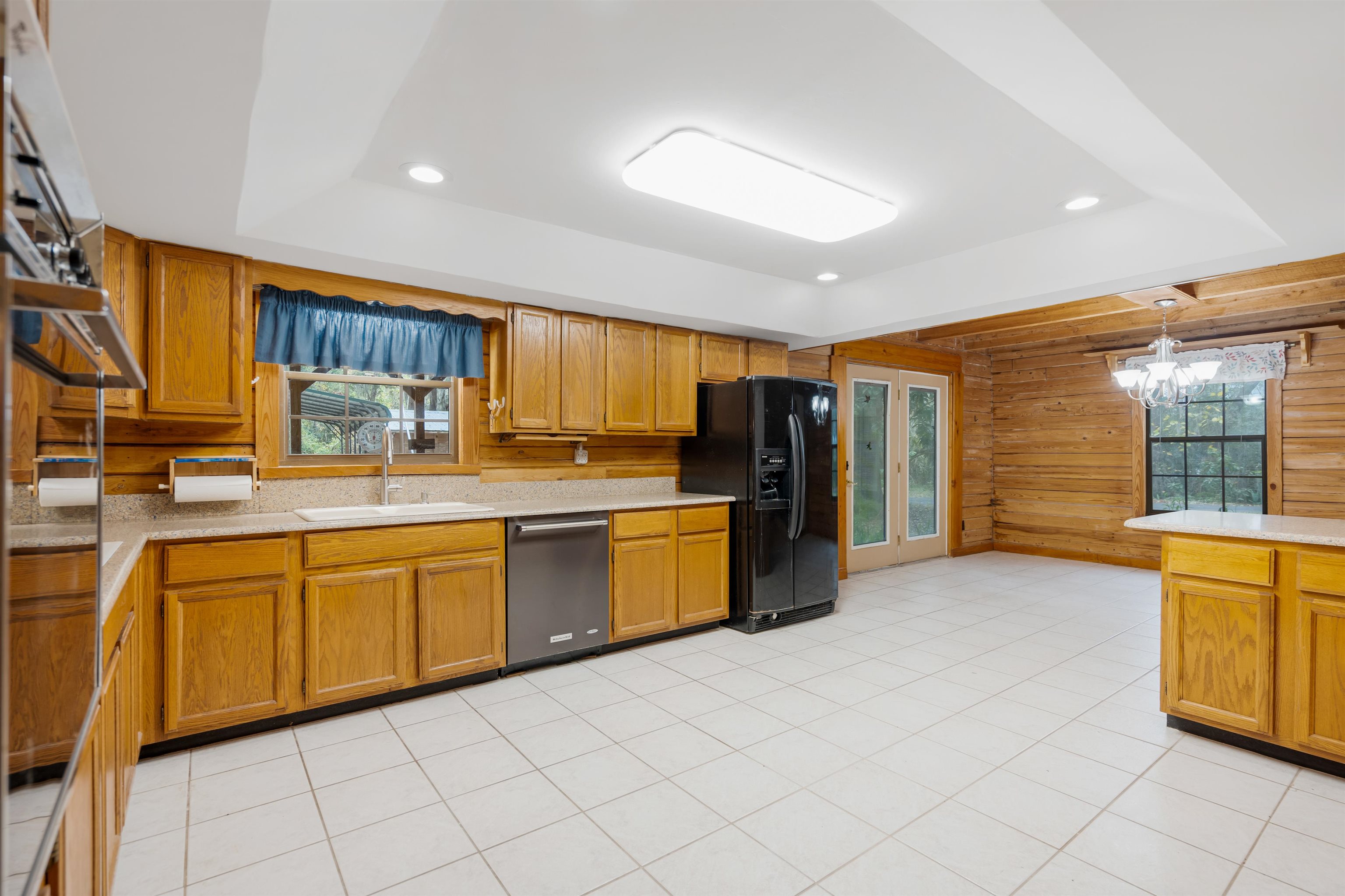 5850 Capo Island Road St. Augustine, FL 32095 - Photo 10 of 39 a kitchen with stainless steel appliances granite countertop a stove a sink and a refrigerator