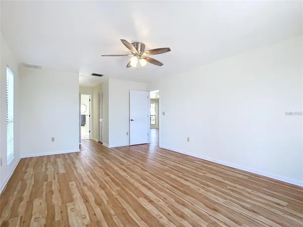 a view of an empty room with a window
