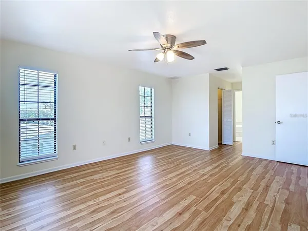 a view of a hallway with a window