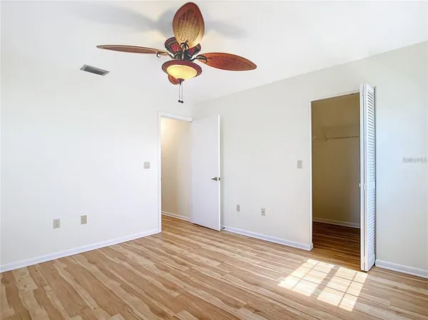 an aerial view of a house with swimming pool and porch