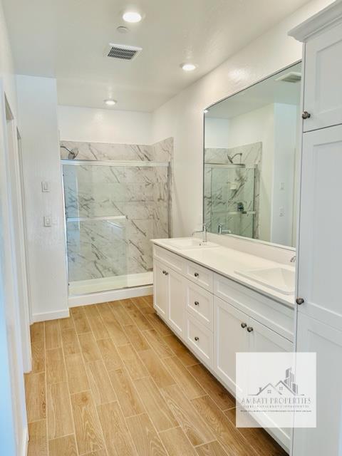 334 Aria Avenue South Madera, CA 93636 - Photo 12 of 20 a bathroom with double vanity sink and a mirror