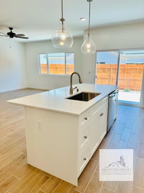 334 Aria Avenue South Madera, CA 93636 - Photo 9 of 20 a kitchen with a sink a stove and cabinets