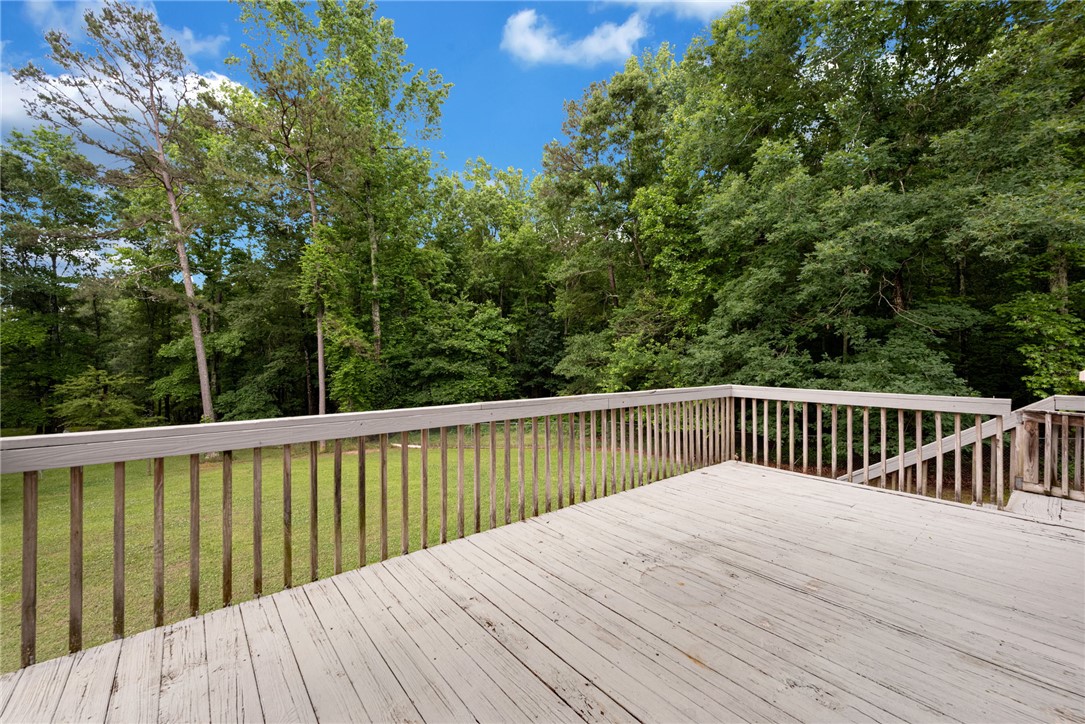 1016 Campbell Road Belton, SC 29627 - Photo 31 of 50 A spacious wooden deck provides tranquil views of a verdant, wooded backyard.
