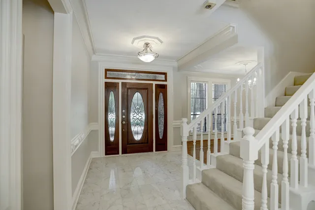 a view of livingroom with stairs and furniture