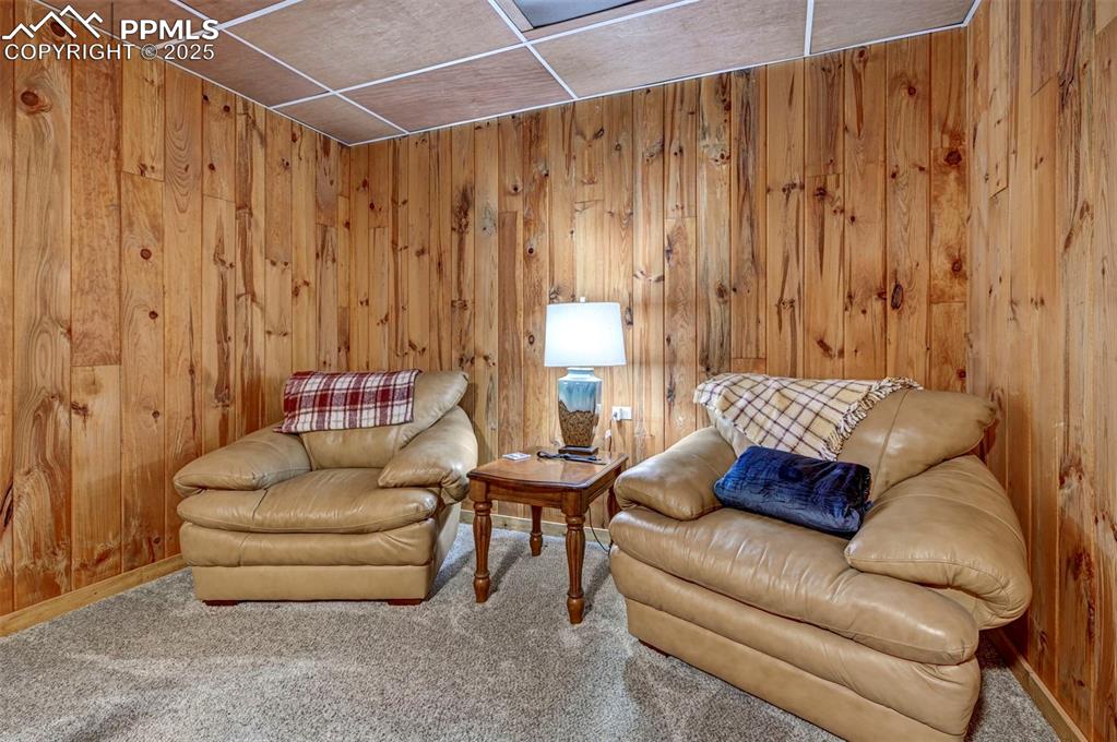 14475 Yoder Road Calhan, CO 80808 - Photo 31 of 50 a living room with furniture and a curtain