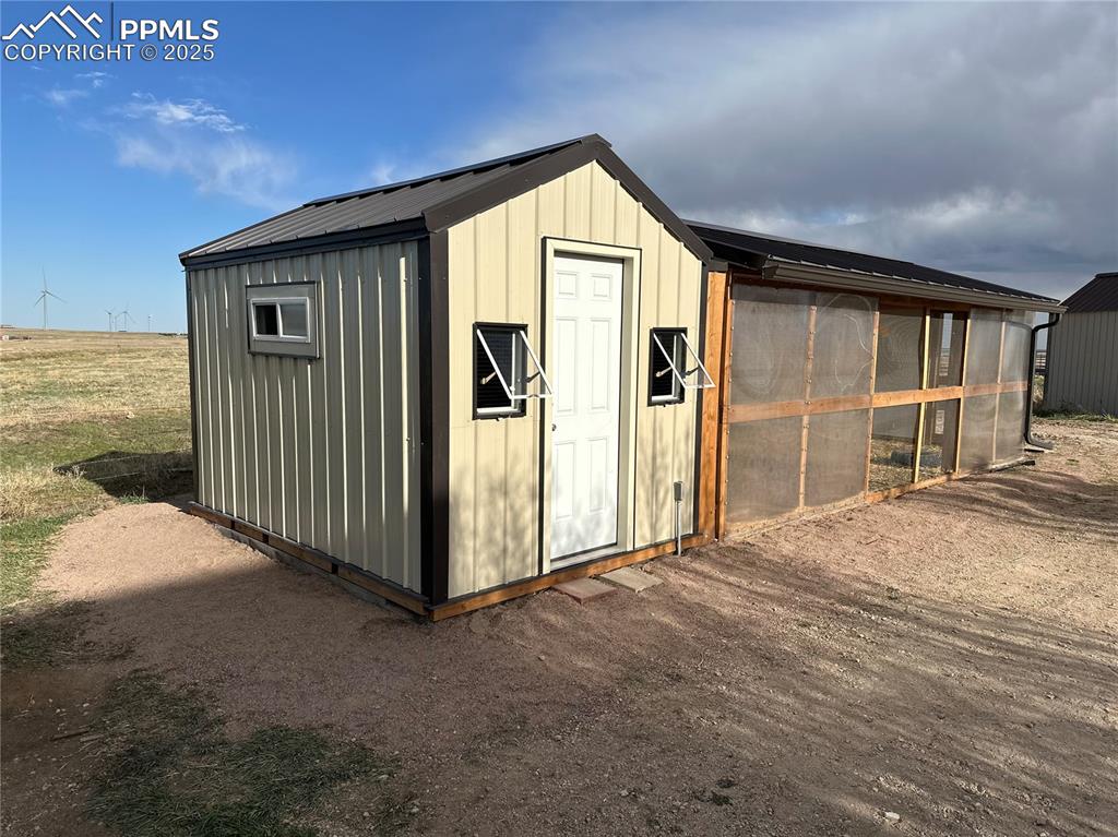 14475 Yoder Road Calhan, CO 80808 - Photo 40 of 50 a view of a house with backyard space and balcony