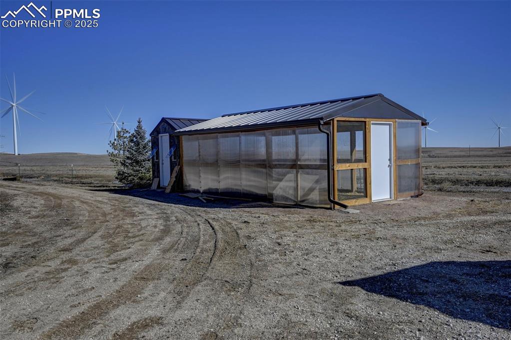 14475 Yoder Road Calhan, CO 80808 - Photo 41 of 50 a view of a house with a yard