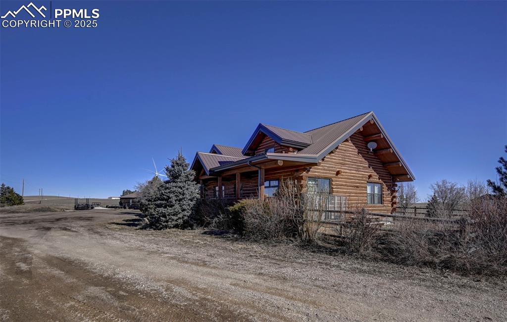 14475 Yoder Road Calhan, CO 80808 - Photo 43 of 50 a front view of a house with a yard
