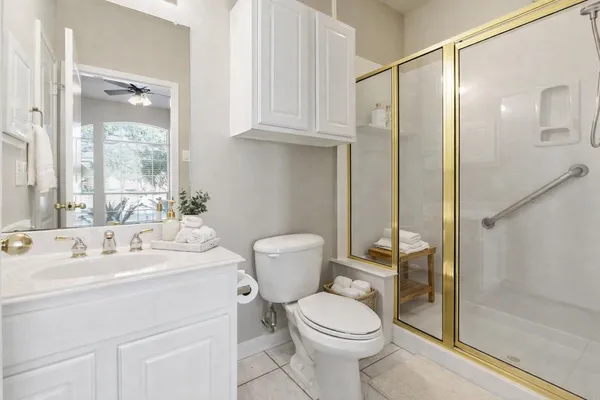 a room with furniture pool table and windows