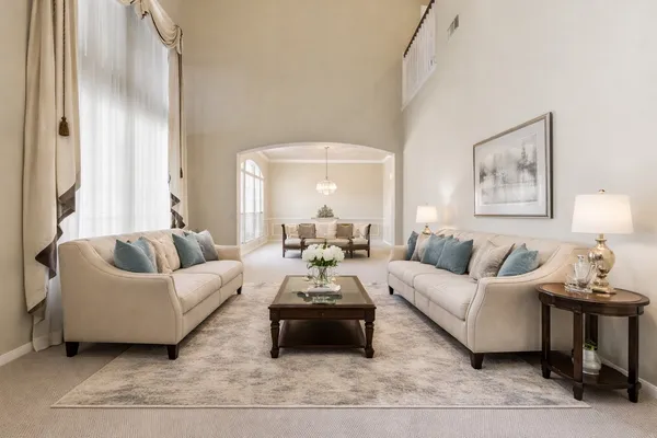 a kitchen with white cabinets a sink stove and refrigerator