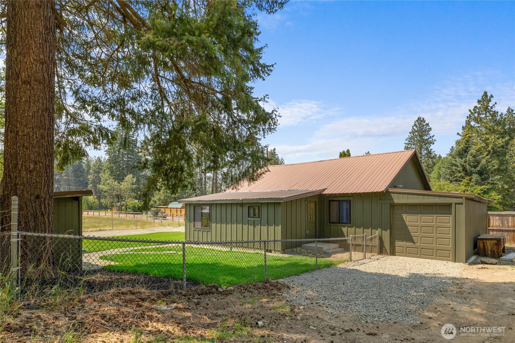 70 Gobblers Knob Road Cle Elum, WA 98922 - Photo 19 of 30 a view of a yard in front of a house with plants and large tree