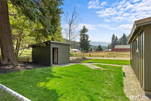 a view of a back yard of the house and a yard