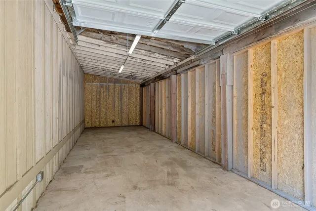 a view of a room with a wooden roof and door