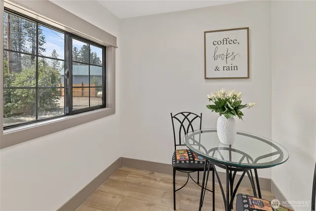a view of a room with furniture and a potted plant