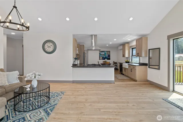 a view of kitchen with cabinets and wooden floor
