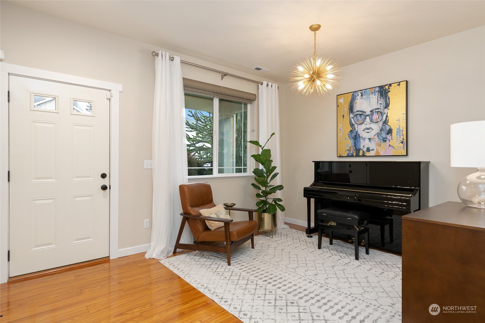573 Field Place Northeast Renton, WA 98059 - Photo 14 of 34 a living room with furniture a piano and a window