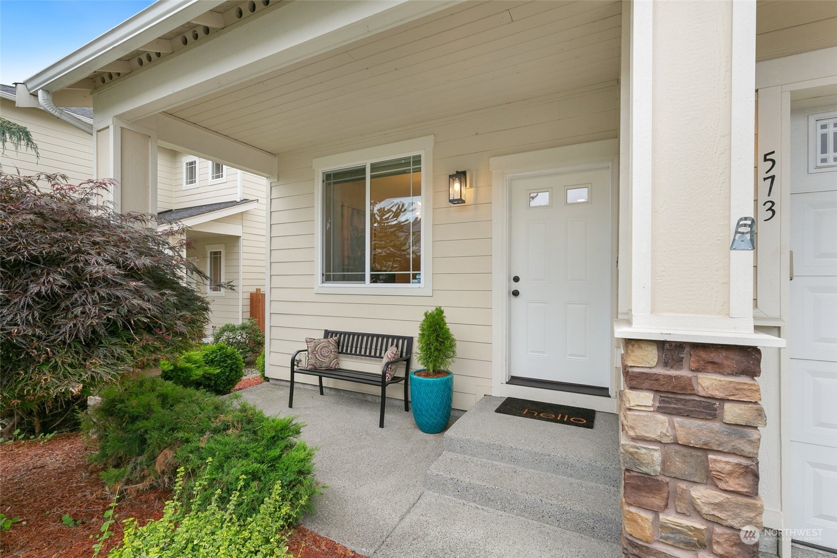 573 Field Place Northeast Renton, WA 98059 - Photo 2 of 34 a view of a brick house with chairs and table and potted plants