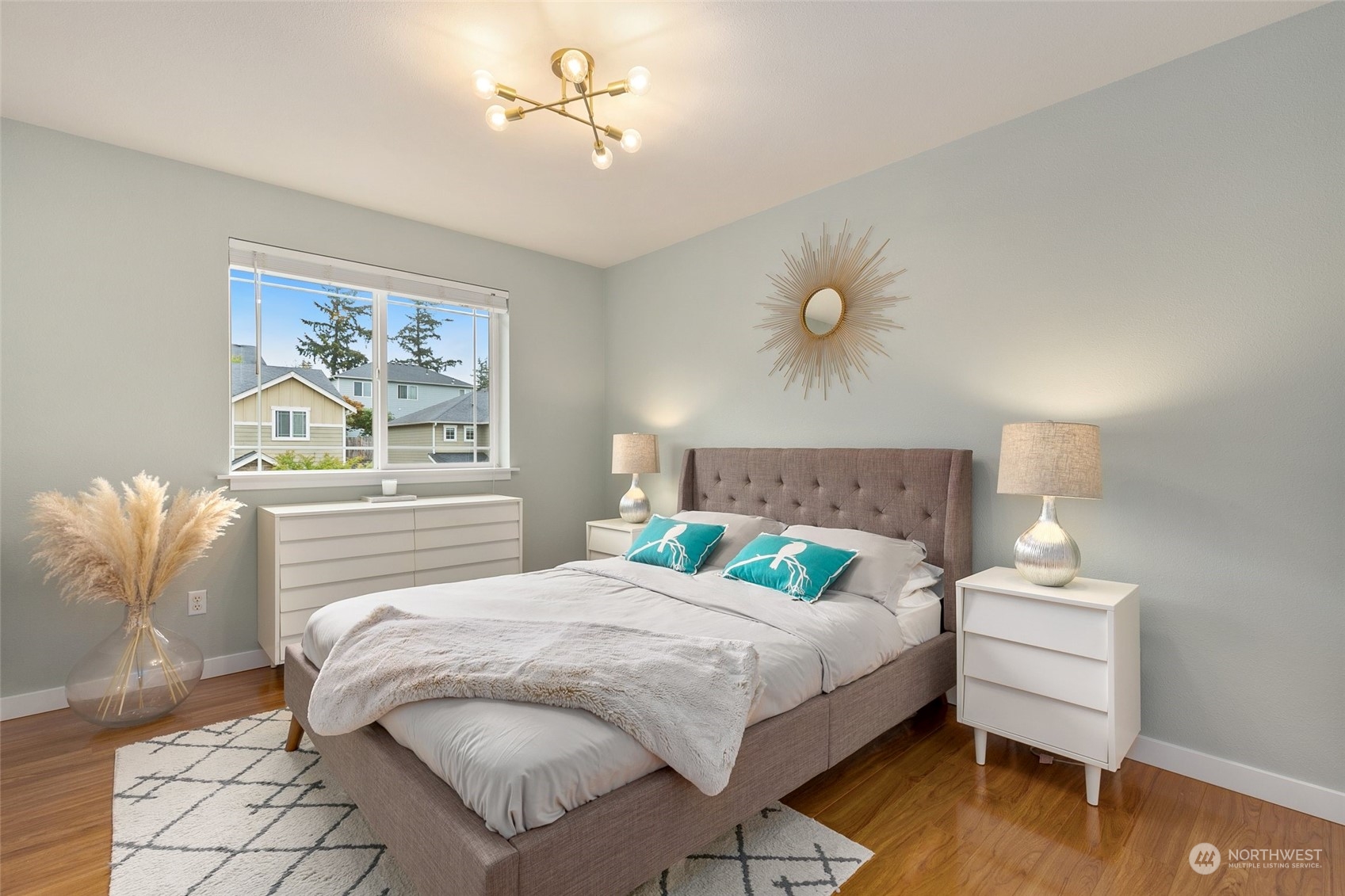 573 Field Place Northeast Renton, WA 98059 - Photo 24 of 34 a bedroom with a bed and a painting on the wall