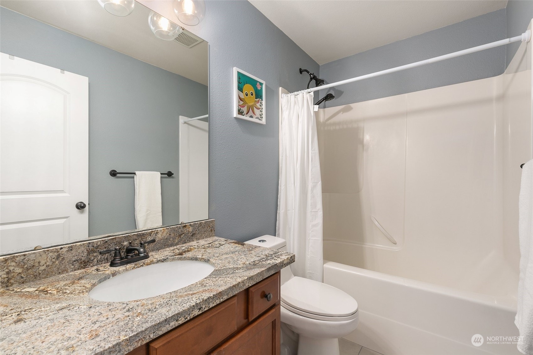 573 Field Place Northeast Renton, WA 98059 - Photo 25 of 34 a bathroom with a granite countertop sink toilet and shower
