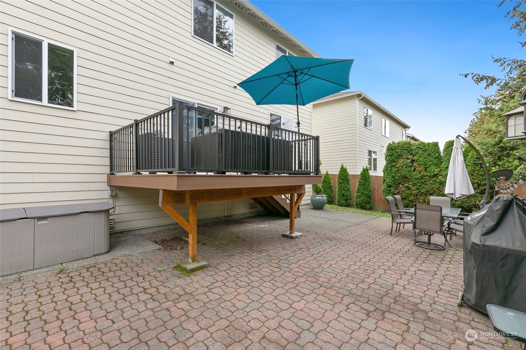 573 Field Place Northeast Renton, WA 98059 - Photo 31 of 34 a table and chairs in a patio