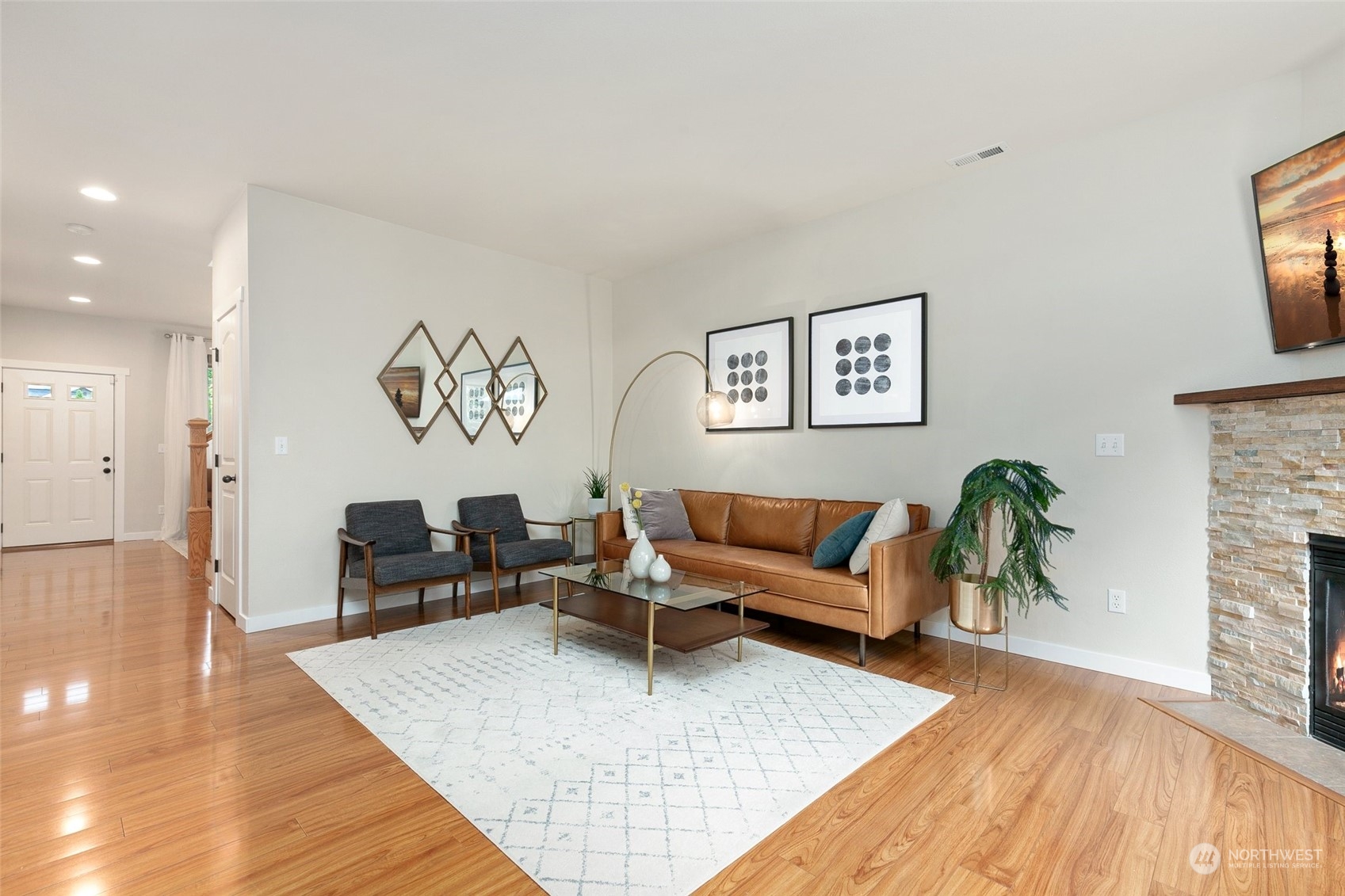 573 Field Place Northeast Renton, WA 98059 - Photo 4 of 34 a living room with furniture and wooden floor